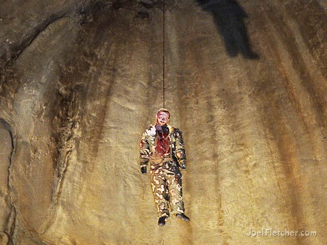 Dead soldier hanging in cave