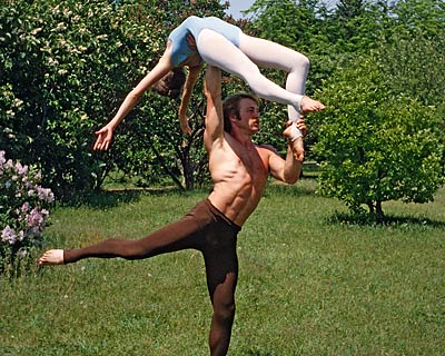 Dancers in a powerful lift pose.