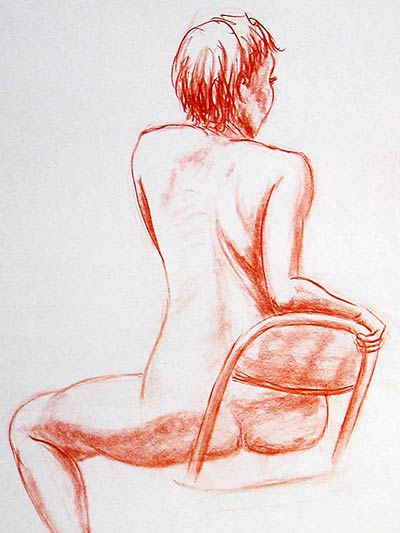 Nude woman on chair.