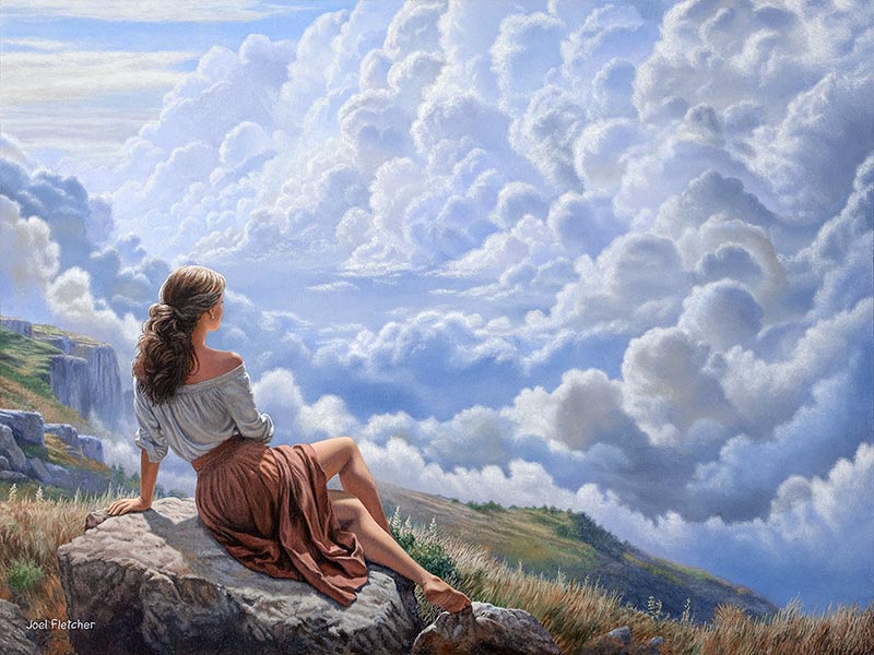 A woman high in the mountains, awestruck by the stunning cloud formations before her.