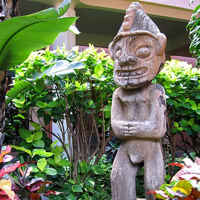  Tiki statue in a garden. 