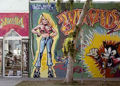 Artistic graffiti covered storefront.